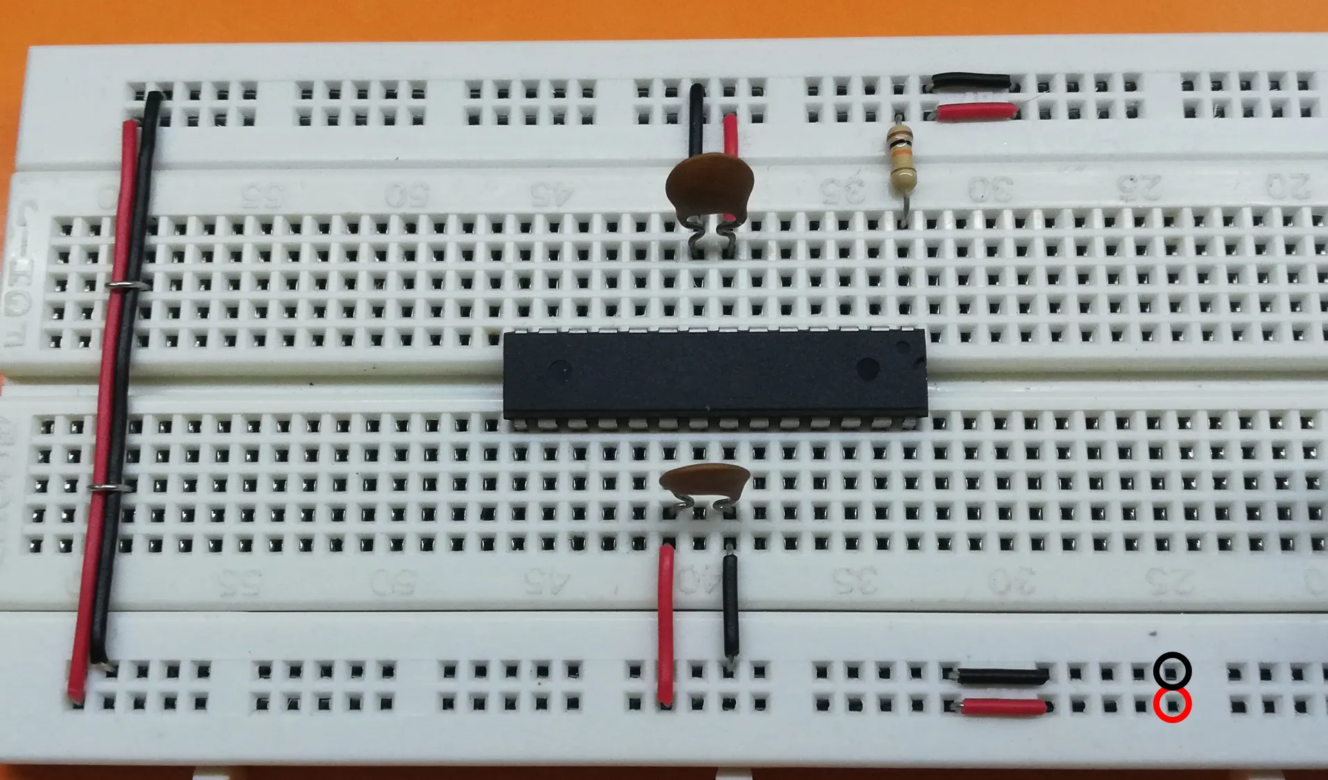 Breadboard wiring with 5V power circled